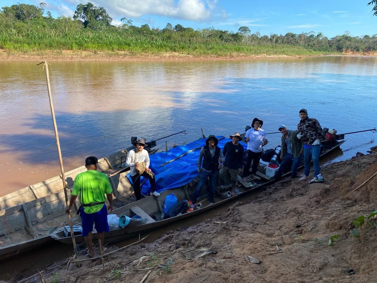 Transporting seedlings in the boat.